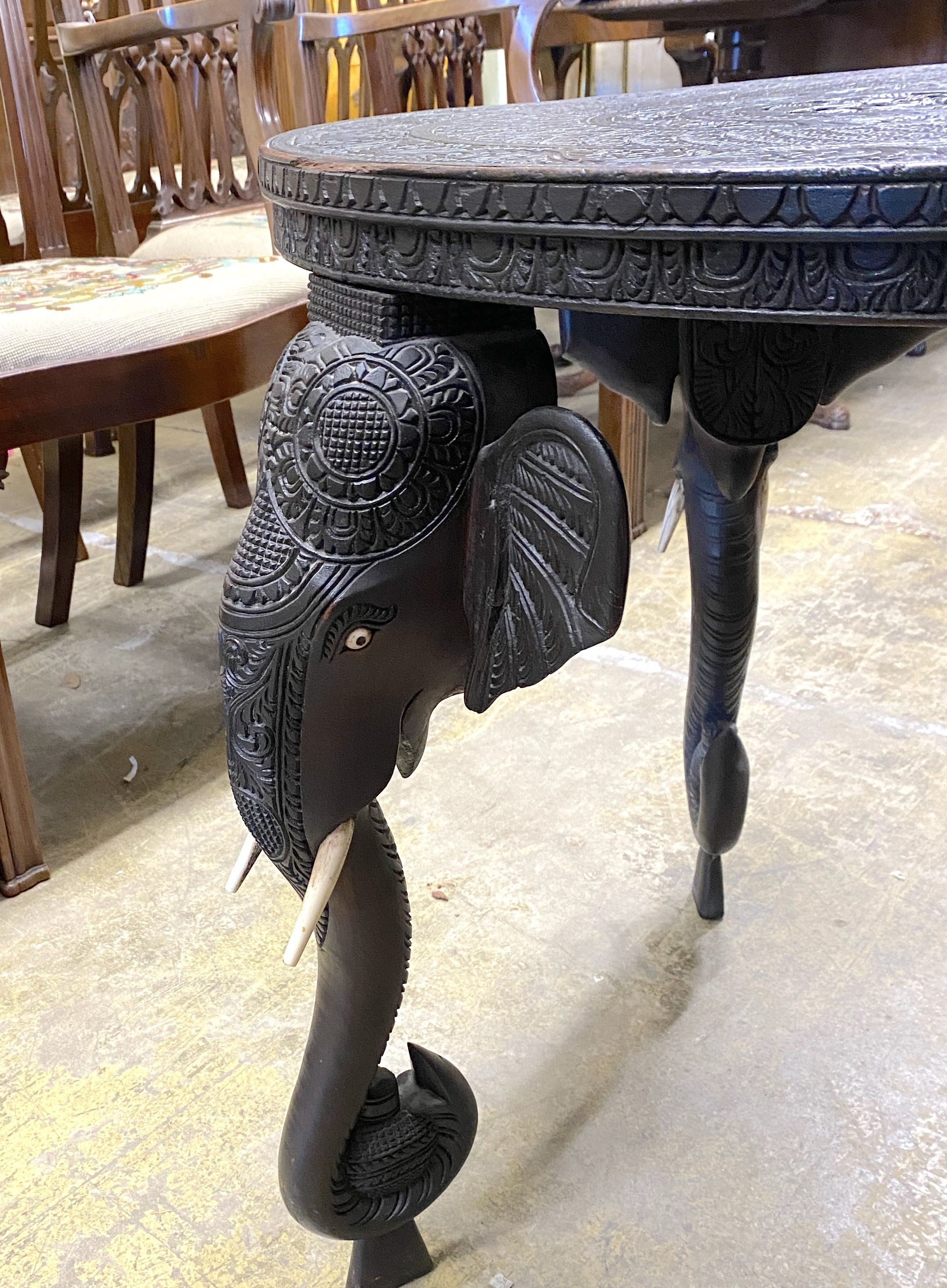 An Indian circular carved hardwood occasional table, diameter 60cm, height 63cm